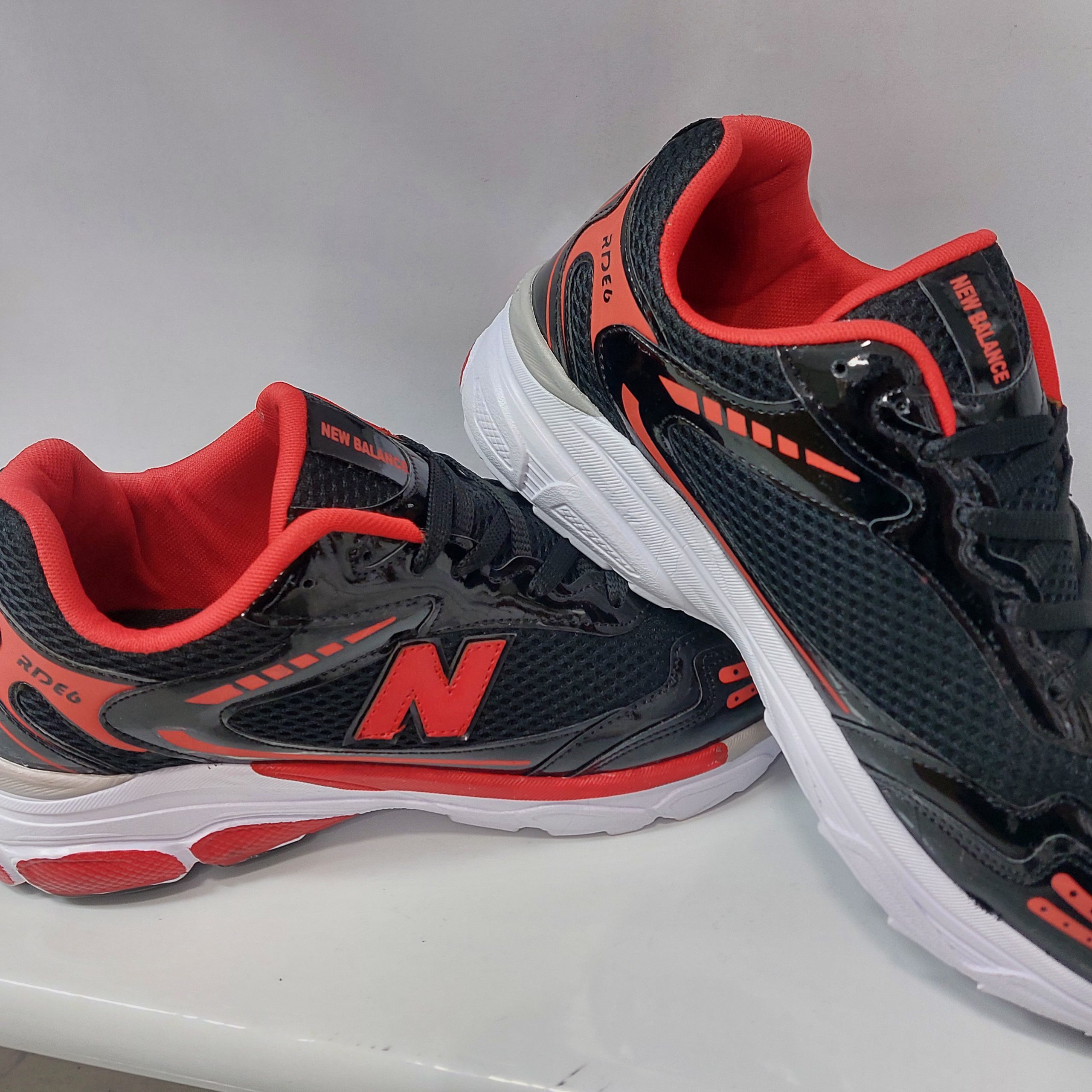 مردانه نیوبالانس مشکی قرمز